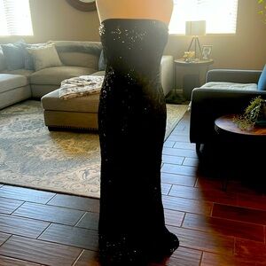 Black sequin strapless gown by Ralph Lauren.